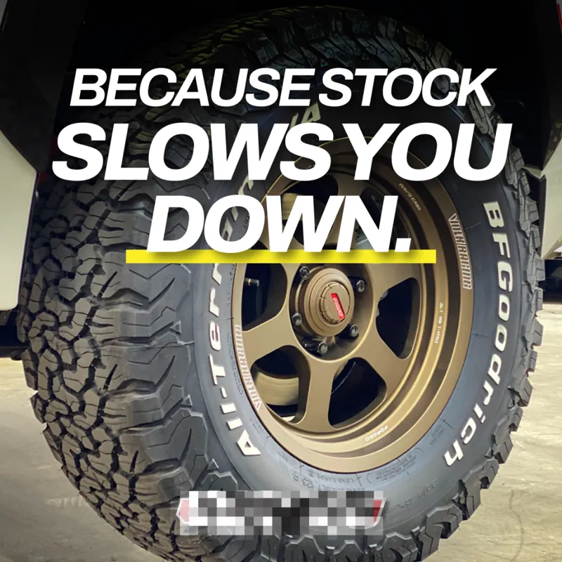 Ad: a close-up of an all-terrain tire with the line 'Because stock slows you down'